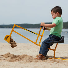 Load image into Gallery viewer, Boy on a Big Dig dumping sand at the Beach