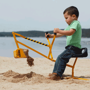 Boy Dumping Sand at the Beach