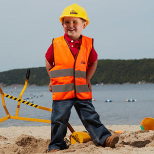Boy at the Beach with Big Dig Helmet and Vest