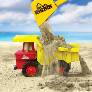 Big Dig Dump Truck on the beach with sand being dropped in by The Big Dig Bucket