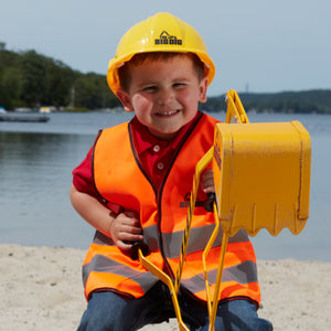 Boy at the Beach on The Big Dig wearing Big Dig Helmet and Vest