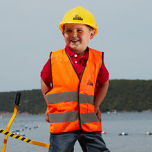 Load image into Gallery viewer, Boy at the Beach in the Big Dig Helmet and Vest